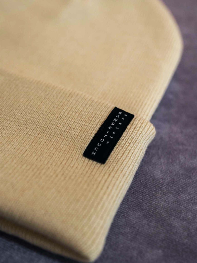 senseitouch logo woven label on beige beanie (7468097732861)