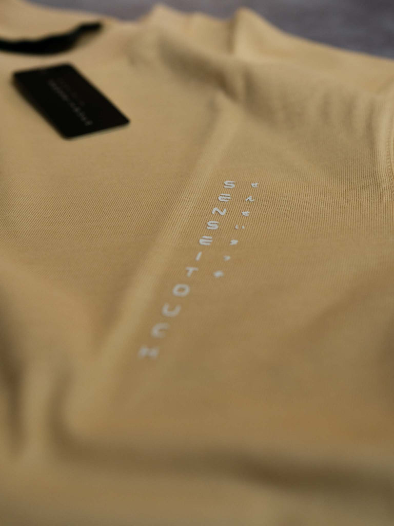 senseitouch logo print on beige shirt (7468312822013)