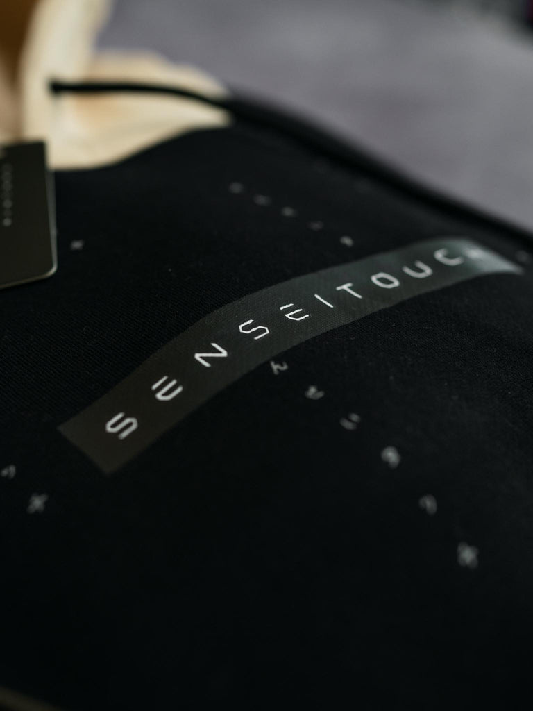 senseitouch pattern logo print closeup 2 color hoodie black and beige (7468258066685)